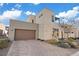 Contemporary home with a large brown garage door and paved driveway at 4302 Swift St, Las Vegas, NV 89135