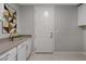 Laundry room with white cabinets and built in counter at 4302 Swift St, Las Vegas, NV 89135