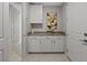 Bright laundry room with white cabinets and storage at 4302 Swift St, Las Vegas, NV 89135