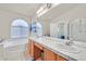 Double vanity bathroom with soaking tub at 4318 Cobblehill Way, North Las Vegas, NV 89032