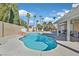 Relaxing kidney-shaped pool with a large patio and a pergola for shade at 4318 Cobblehill Way, North Las Vegas, NV 89032