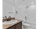 Clean bathroom with tub, shower, and granite vanity at 4543 Pencester St, Las Vegas, NV 89115