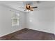 Spacious bedroom with ceiling fan and neutral carpeting at 4543 Pencester St, Las Vegas, NV 89115