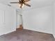 Spacious bedroom with ceiling fan and neutral carpeting at 4543 Pencester St, Las Vegas, NV 89115