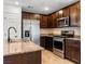 Modern kitchen with stainless steel appliances and granite countertops at 4543 Pencester St, Las Vegas, NV 89115