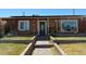 Charming home featuring a landscaped front yard with a brick walkway leading to the front door at 4559 S Nellis Blvd, Las Vegas, NV 89121