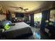 Inviting main bedroom featuring a ceiling fan, a window, and tile flooring at 4559 S Nellis Blvd, Las Vegas, NV 89121