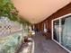 Outdoor patio featuring an awning, foliage, and access to multiple rooms at 4559 S Nellis Blvd, Las Vegas, NV 89121