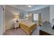 Bright bedroom with double bed and neutral decor at 4710 Blaise Ave # 101, North Las Vegas, NV 89084