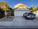 Two-story house with attached garage and landscaped front yard at 508 Sarajane Ln, Las Vegas, NV 89107