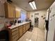 View of kitchen with wood cabinets and tiled floor at 508 Sarajane Ln, Las Vegas, NV 89107