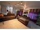 Living room with brown couches and view of staircase at 508 Sarajane Ln, Las Vegas, NV 89107