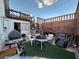 Small fenced patio with grill and seating area at 508 Sarajane Ln, Las Vegas, NV 89107