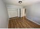 Bright bedroom with wood-look floors and spacious closet at 520 S 13Th St # D4, Las Vegas, NV 89101