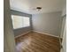 Bedroom with wood-look floors and window at 520 S 13Th St # D4, Las Vegas, NV 89101