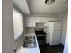 White kitchen with stainless steel appliances at 520 S 13Th St # D4, Las Vegas, NV 89101