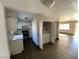 Kitchen with white cabinets, stainless appliances, and laundry area at 520 S 13Th St # D4, Las Vegas, NV 89101