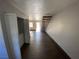 View of living room, stairs, and laundry closet at 520 S 13Th St # D4, Las Vegas, NV 89101