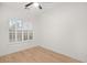 Spacious bedroom with light walls and hardwood floors at 6004 Chessington Ave, Las Vegas, NV 89131