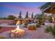 Resort-style pool with waterfall, grotto, and fire pit at 6004 Chessington Ave, Las Vegas, NV 89131