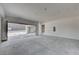 Unfinished garage with large door opening to backyard at 607 Grand Rim Dr, Henderson, NV 89012