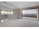 Interior view of a room with access to a balcony and city views at 607 Grand Rim Dr, Henderson, NV 89012