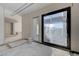 Interior view of an under-construction home showcasing a large window and unfinished walls at 607 Grand Rim Dr, Henderson, NV 89012