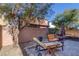 Relaxing backyard with patio furniture and grill at 634 Wounded Star Ave, Las Vegas, NV 89178