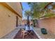 Small, private backyard with patio and gravel landscaping at 634 Wounded Star Ave, Las Vegas, NV 89178