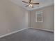 Simple bedroom with ceiling fan and window at 634 Wounded Star Ave, Las Vegas, NV 89178