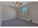 Bright bedroom featuring a ceiling fan and large window at 634 Wounded Star Ave, Las Vegas, NV 89178