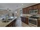 Modern kitchen with stainless steel appliances and granite countertops at 634 Wounded Star Ave, Las Vegas, NV 89178