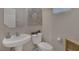 Clean powder room with pedestal sink and toilet at 634 Wounded Star Ave, Las Vegas, NV 89178