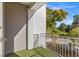 Cozy balcony featuring an artificial lawn, white railing, and views of the surrounding greenery at 656 Tam O Shanter, Las Vegas, NV 89109