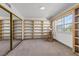 Versatile room with ample built-in shelving and a mirrored closet, perfect for storage or display at 656 Tam O Shanter, Las Vegas, NV 89109