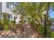 Picturesque brick pathway lined with green shrubbery leading to well-maintained townhouses at 656 Tam O Shanter, Las Vegas, NV 89109