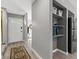 Hallway with shelves, modern appliances, and a view of the front door at 656 Tam O Shanter, Las Vegas, NV 89109