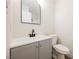 Updated bathroom with gray vanity and modern fixtures at 6750 Laronda Ln, Las Vegas, NV 89156