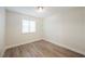 Simple bedroom with wood-look flooring and a closet at 6750 Laronda Ln, Las Vegas, NV 89156