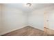 Spacious bedroom with wood-look flooring and a closet at 6750 Laronda Ln, Las Vegas, NV 89156