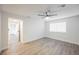 Light and airy bedroom with wood-look floors at 6750 Laronda Ln, Las Vegas, NV 89156