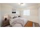 Charming bedroom with a comfortable bed and a stylish bench at the foot at 6750 Laronda Ln, Las Vegas, NV 89156