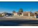 Single story home with a 2 car garage and landscaped yard at 6750 Laronda Ln, Las Vegas, NV 89156