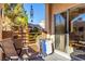 Spacious balcony with sliding doors and outdoor seating at 6885 Tamarus St # 201, Las Vegas, NV 89119