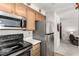 Kitchen with stainless steel appliances at 6885 Tamarus St # 201, Las Vegas, NV 89119