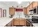 Galley kitchen with stainless steel appliances at 6885 Tamarus St # 201, Las Vegas, NV 89119