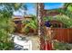 Landscaped backyard pathway with lush greenery at 7436 Oak Grove Ave, Las Vegas, NV 89117