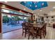 Elegant dining room with hardwood floors, large sliding doors, and a view of the pool at 7436 Oak Grove Ave, Las Vegas, NV 89117