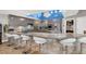 Large kitchen island with seating, granite countertops and stainless steel appliances at 7436 Oak Grove Ave, Las Vegas, NV 89117