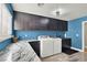 Bright laundry room, featuring granite countertops and modern appliances at 7436 Oak Grove Ave, Las Vegas, NV 89117